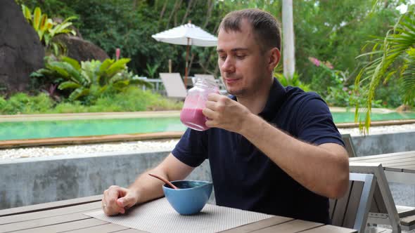 Portrait of Man Enjoy Healthy Vegan Organic Beverage From Jar