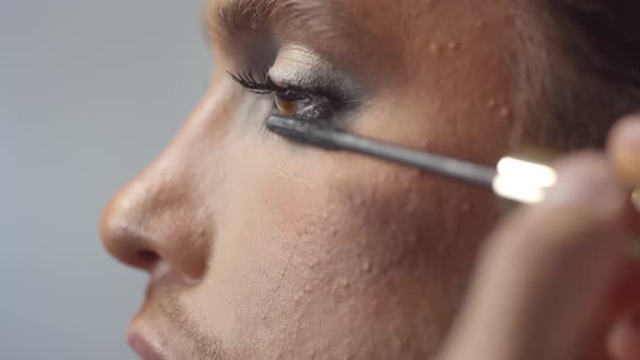 Applying Mascara on Handsome Man