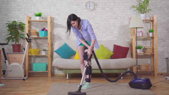 Housewife After Injury Knee Bend Orthosis Knee Brace Vacuums in the Living Room