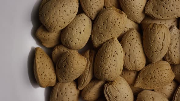 Cinematic, rotating shot of almonds on a white surface - ALMONDS 119