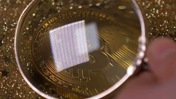 Macro Coin Under Magnifier Belongs to Cryptocurrency Bitcoin