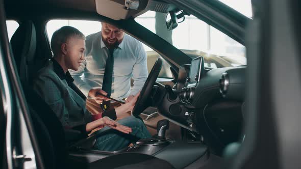 Beautiful Young Businesswoman Buying New Car