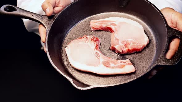 Chef Presents Pork Chops in a Skillet