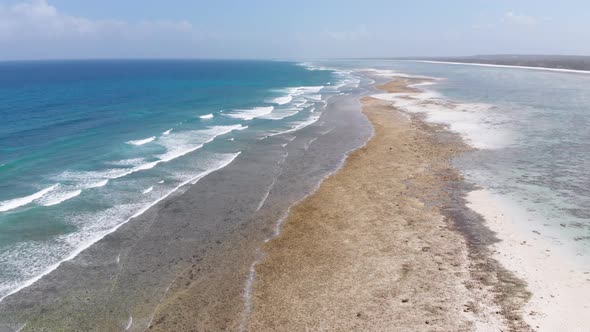 Ocean Coastline and Barrier Reef at Low Tide Zanzibar Matemwe Aerial View