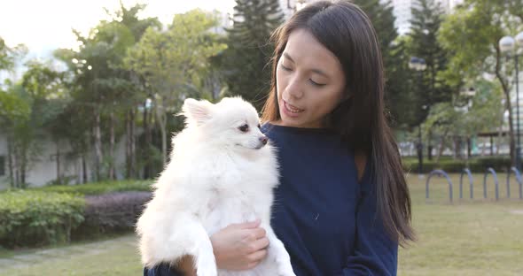 Woman being with her dog in the park