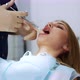 Dentist Gives an Analgesic Injection Into the Tooth of a Beautiful Woman - VideoHive Item for Sale