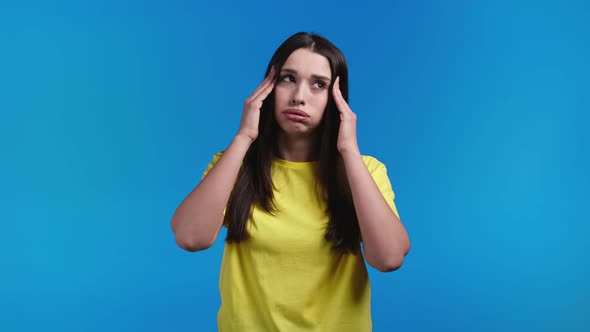 Bored Woman Portrait Her Head is Spinning Around on Blue Background