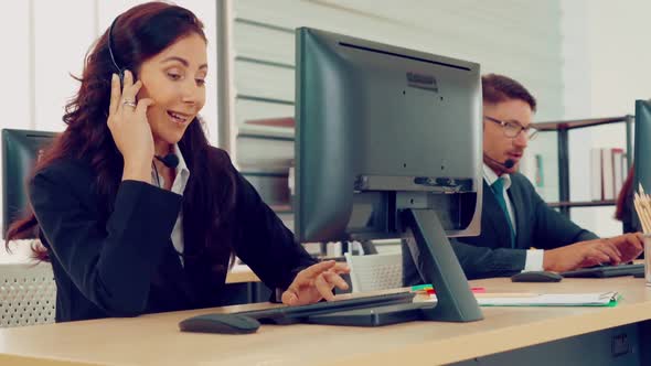 Business People Wearing Headset Working in Office