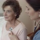 Home Nurse Listening For Breathing of Elderly Woman Sitting on Bed. - VideoHive Item for Sale