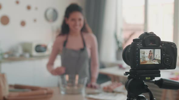 Blurred Vlogger Filming Vlog in Kitchen