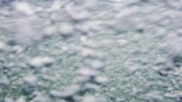 Amazing air bubbles in an agitated river. Underwater air bubbles