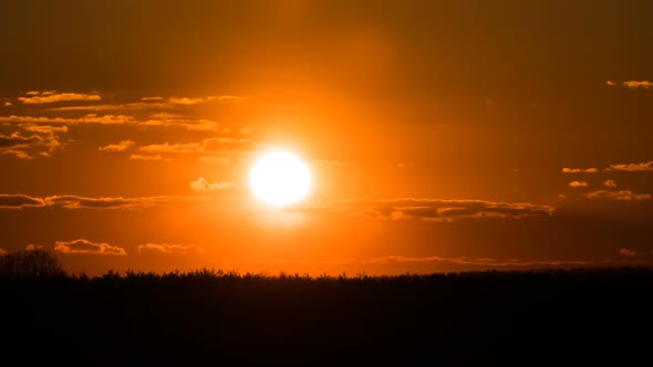 Sunset Over the Trees and Clouds