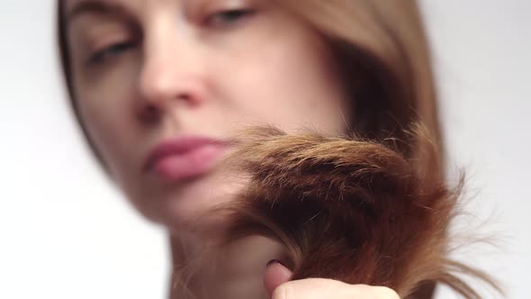 Closeup of Bunch of Brown Female Hair Tips Front View