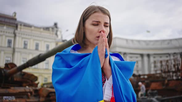 Woman Prays for Peace Putting Hands in Prayer Gesture