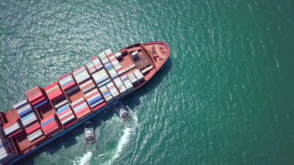 top view of cargo ship passing the harbor