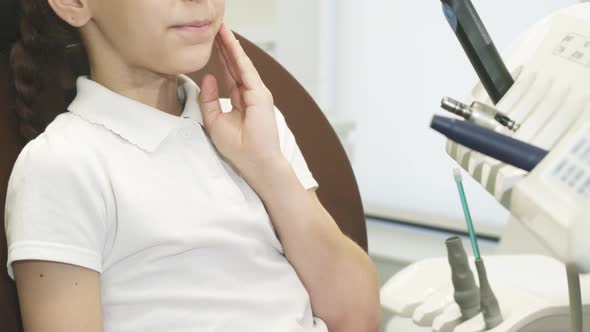 Close-up of Girl's Jaw in Which Acute Toothache