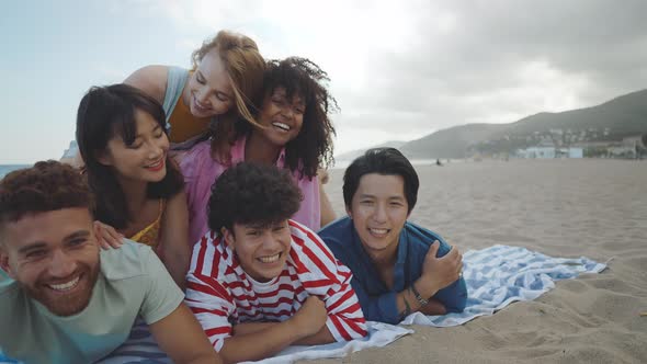 Group of friends having fun on the beach.