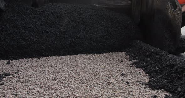 Paver Applying Asphalt On The Highway.A Huge Heavy Equipment Flatten Hot Asphalt