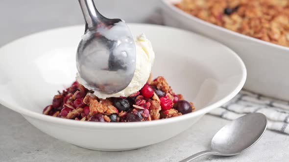 Berry Crumble Pie with Scoop of Ice Cream in Plate