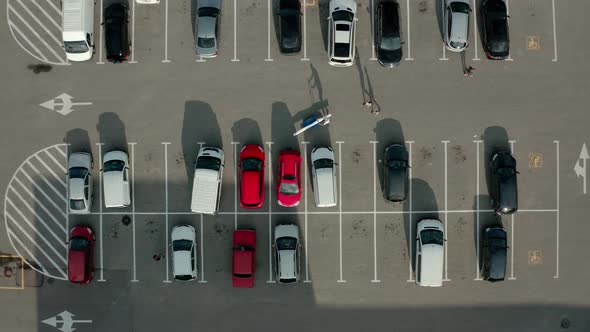 Top Aerial Drone View Car Driving and Parked Free Parking Space. View From Above Flying Drone Cars