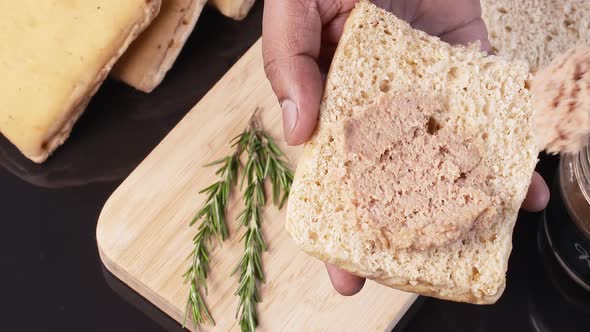 Spreading Pate On Foccacia Bread