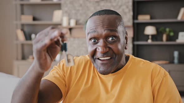Mature African American Man Happy Homeowner Male Realtor Buyer Showing Bunch of Keys From New Estate