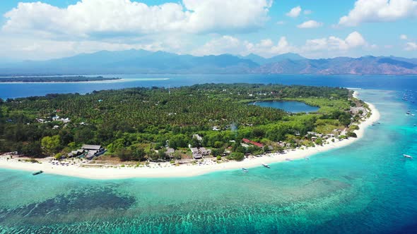 Tropical aerial tourism shot of a white sand paradise beach and turquoise sea background in high res