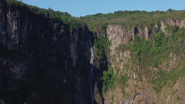 Drone shot of Mutarazi Falls in Zimbabwe - drone is reversing, flying away from the bigger waterfall