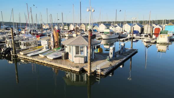 Dock Pier Gas Pump Gazebo with kayaks, boats, sailboats, birds flying, beautiful reflection in water