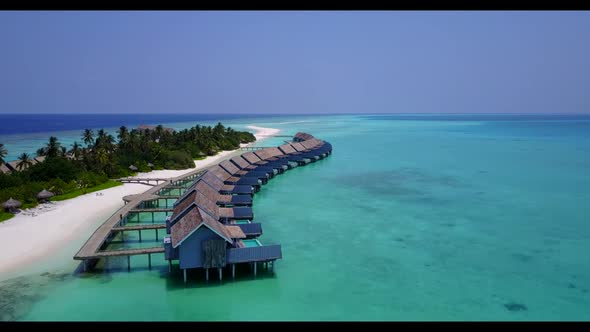 Aerial top down tourism of beautiful lagoon beach lifestyle by aqua blue lagoon with white sand back
