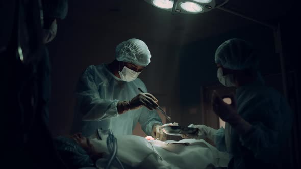 Medical Staff Performing Surgical Operation in Dark Hospital Emergency Room