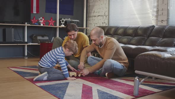 LGBTQ Family with Kid Playing with Toys