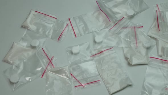 Many Small Portions Of Cocaine On The Table