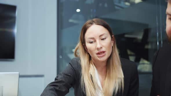 Businesswoman at Meeting in Office with Colleagues