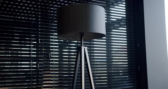 Black Minimalist Circular Floor Lamp Next to a Window with Modern Black Blinds