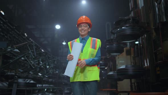 Cheerful Woman Supervisor Walking at Digital Manufacturing Company Warehouse