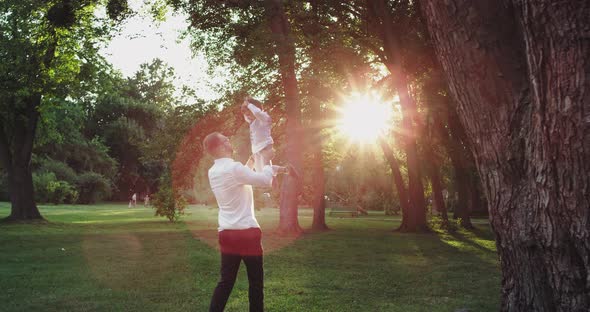 Daddy Playing Very Lovely with His Son in the Park