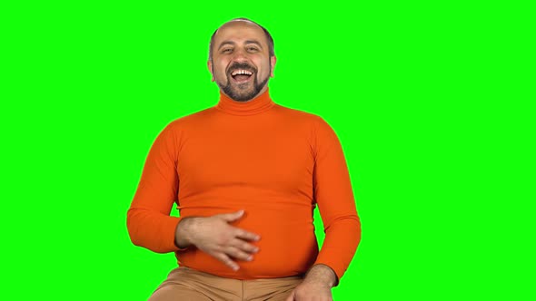 Full Caucasian Man Looking at Camera Smiling Broadly, Laughing Out Loud. Green Screen