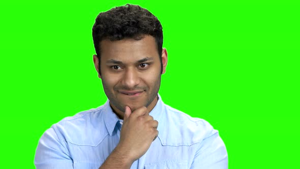 Young Man with Thoughtful Expression on Green Screen