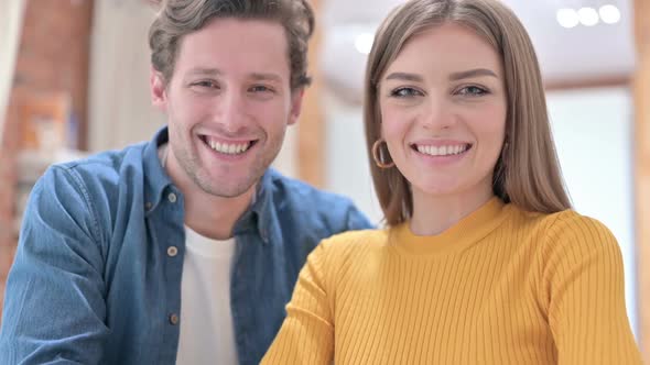 Portrait of Smiling Office Colleagues Looking at the Camera