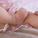 Young Mother Rubs Cream on the Baby Girl - VideoHive Item for Sale