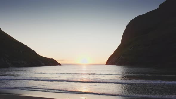 Aerial View of Sunset on the Beach with Awesome Sun Golden Reflection on Calm Waves