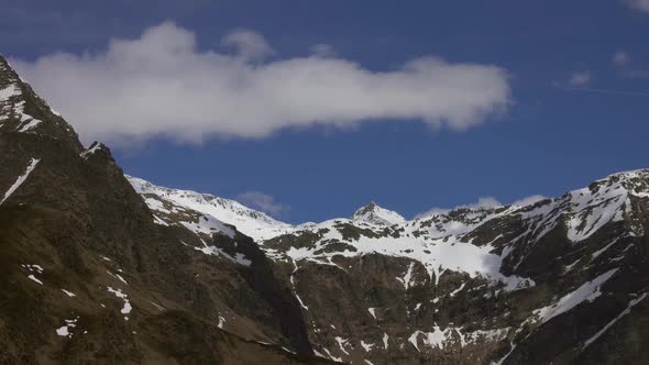 Louds Over Tops of Snow-capped Mountains in Alps