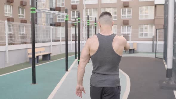 A Young Man is Doing Outdoors Workout