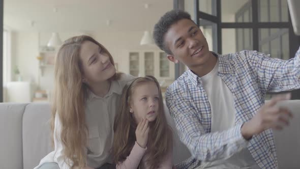 Beautiful Young International Family at Home, African American Man, Caucasian Woman and Small Girl