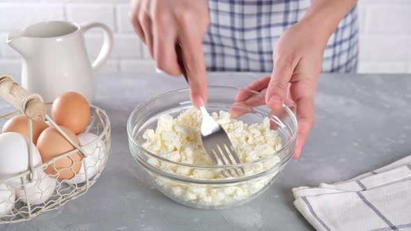 Cottage cheese or farmer's cheese in a glass bowl on the kitchen table