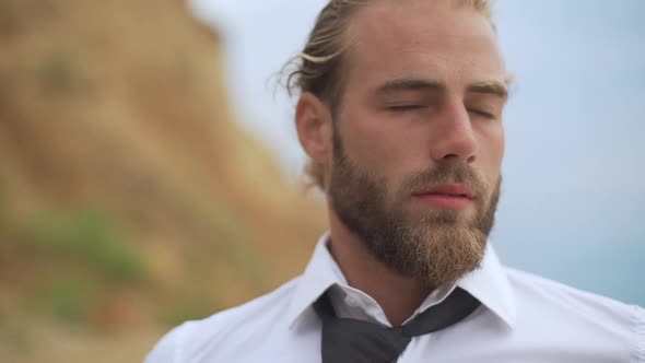 Closeup Bearded Guy Inhaling Deeply Enjoying Sea Breeze After Work on Nature in Slow Motion