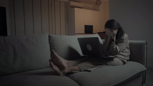 Tired Woman Using Computer At Night