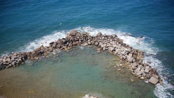 A clear blue water in Sorrento. A white seagull flying by