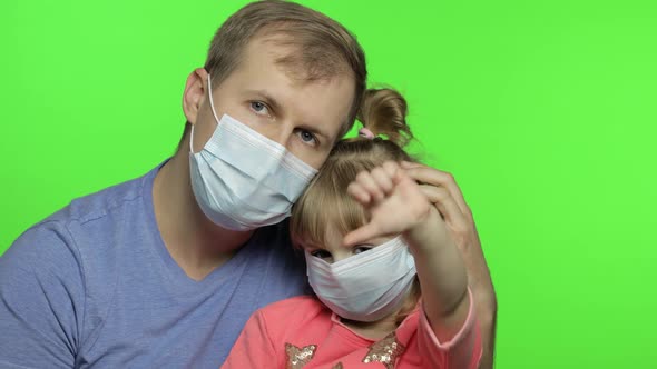 Sick Father and Daughter in Medical Mask. Coronavirus Concept. Family Quarantine